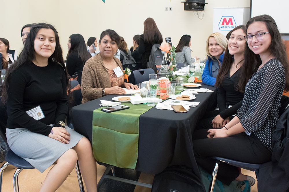 group of people at conference, eating