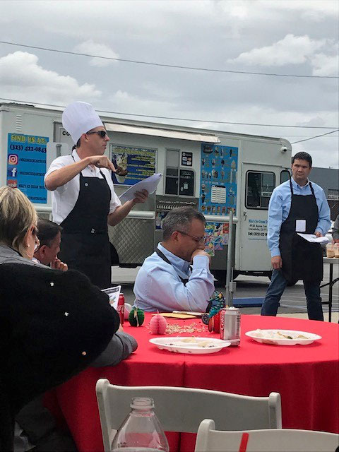 chef standing in front of food truck